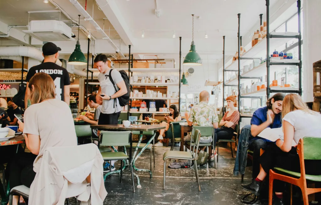 Office workplace canteen or breakroom with people and food